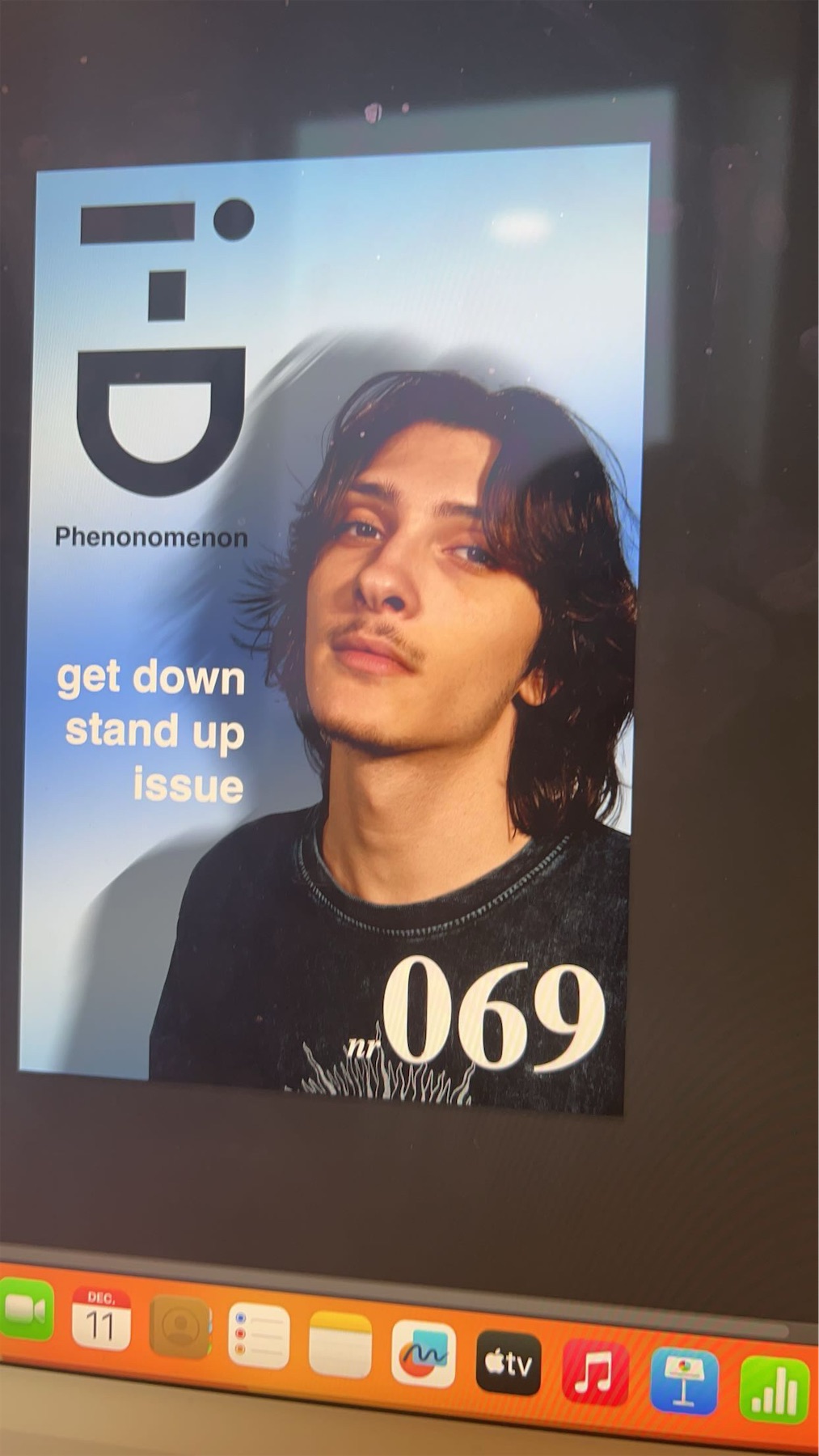 Magazine cover on a screen: a portrait against a light blue background with the i-D logo, the title Phenonomenon, the text get down stand up issue and the number 069.
