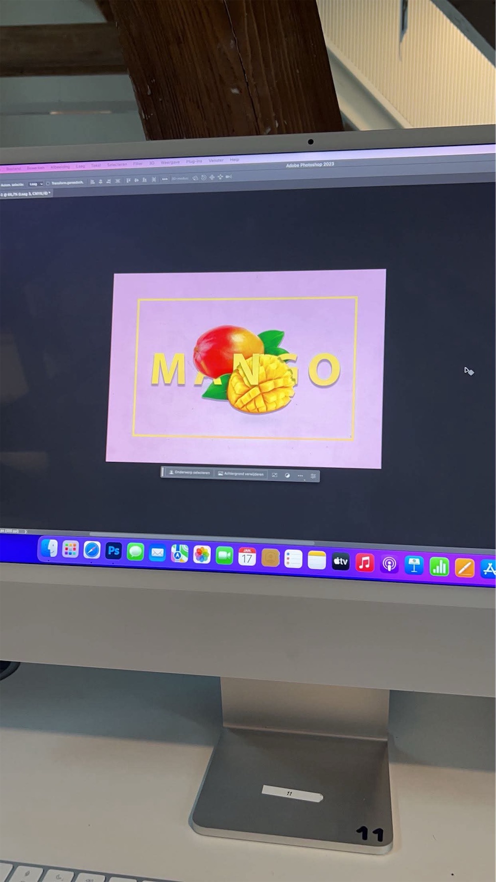 Design on a computer screen with a mango, a cut mango half and yellow letters on a pastel purple background.